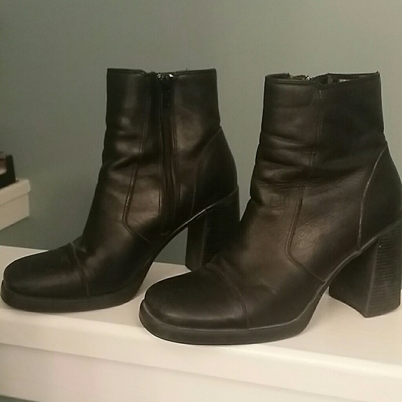 Black leather booties with black zipper.