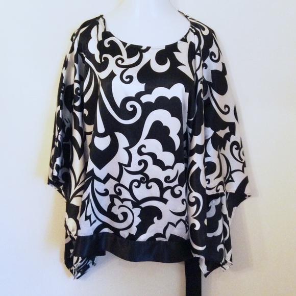 Lane Bryant Tops - | dramatic white & black top |
