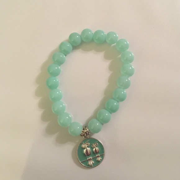 Light blue bracelet with two owls charm