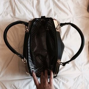 Charming Charlie Bags - Black and gold hand bag Charming Charlie Bags - Black and gold hand bag