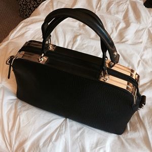 Charming Charlie Bags - Black and gold hand bag Charming Charlie Bags - Black and gold hand bag