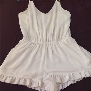 spaghetti strap romper with flowy bottom ruffles