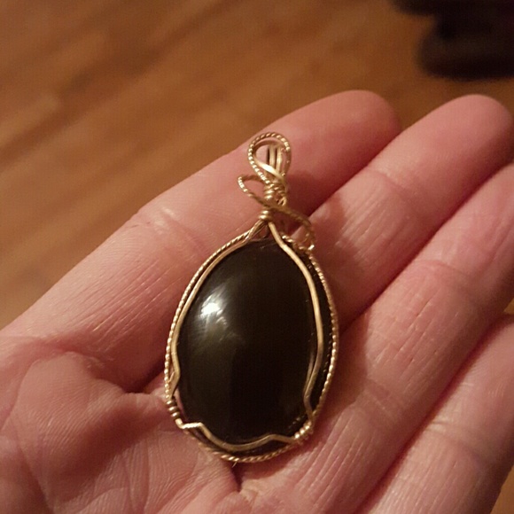 Gold with black stone charm