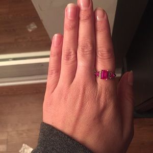 Silver ring with three rubys.