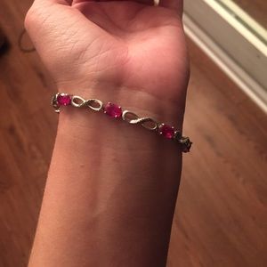 Silver infinity and ruby bracelet