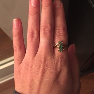 Gold ring with emerald stones