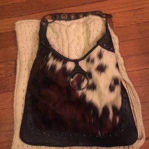 A leather and cow hide purse