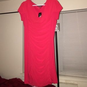 Brand new, red right above the knee