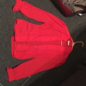 Coral colored sheer long sleeve blouse