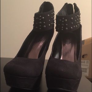 Microsuede black platform heels.