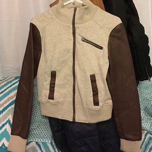 A cloth/leather brown tan jacket.