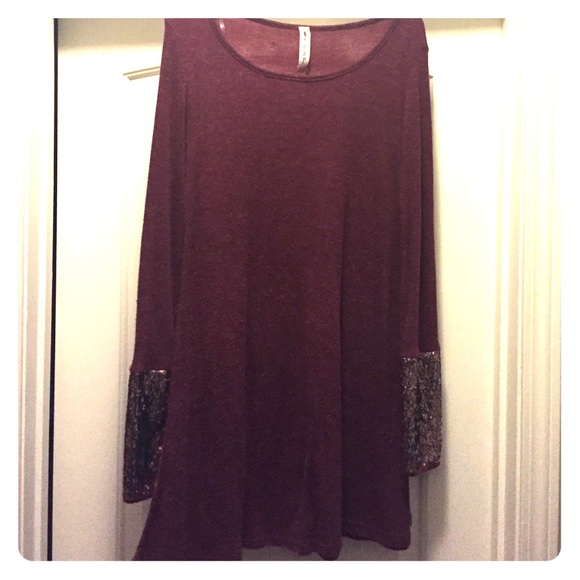 Red dress with sparkly edges on the sleeves