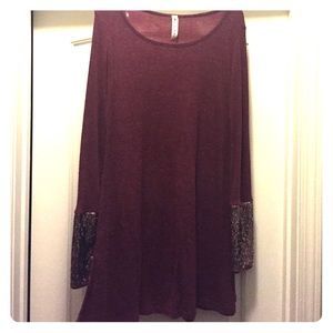 Red dress with sparkly edges on the sleeves