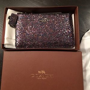 Coach sparkle wristlet.