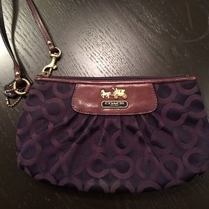 Used purple Coach wristlet.