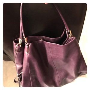Purple Coach hobo bag.