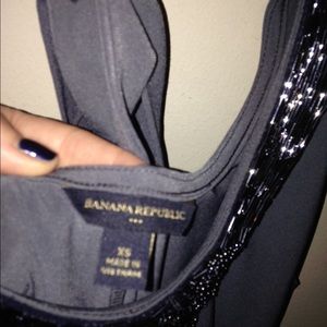 Grey dressy sleeveless shirt with tieback neck