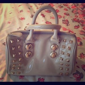Beige patent bowler handbag
