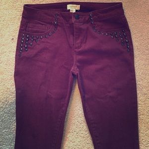 Maroon skinny jeans with studs. Size 28