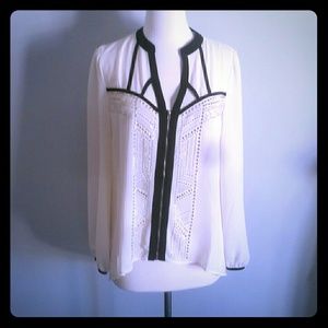Sheer cream blouse with gold grommets and black pu