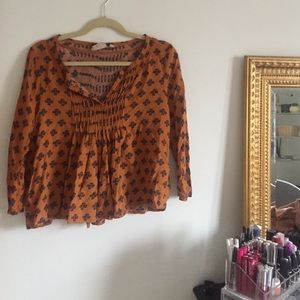 Patterned burnt orange blouse