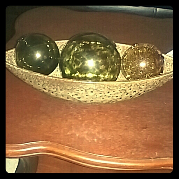 Three glass color stained balls with the bowl