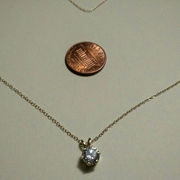 Delicate diamond-like charm on gold chain