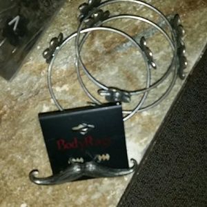 3 bangle bracelets with flower design