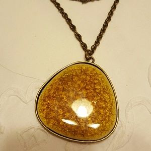 Gold tones glass looking necklace