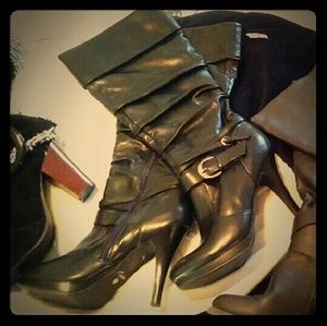 Below the knee high heeled boots with buckles