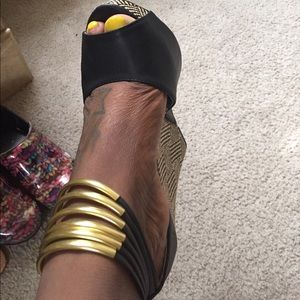 Black and gold Bebe wedges