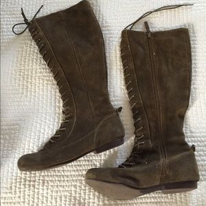 Green suede lace up knee high boots.