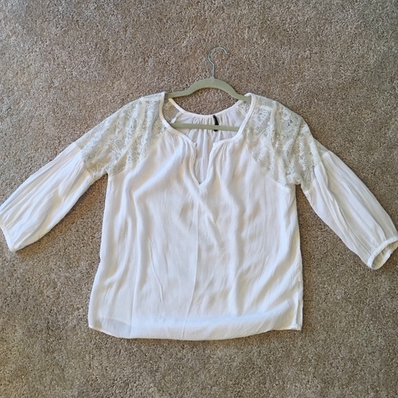 White lace-detailed blouse.