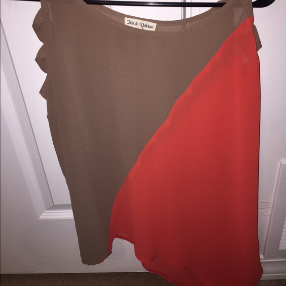 Brown and orange top. Shoulder cutouts. Angled cut
