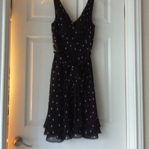 Black with white dots dress .V neck both side