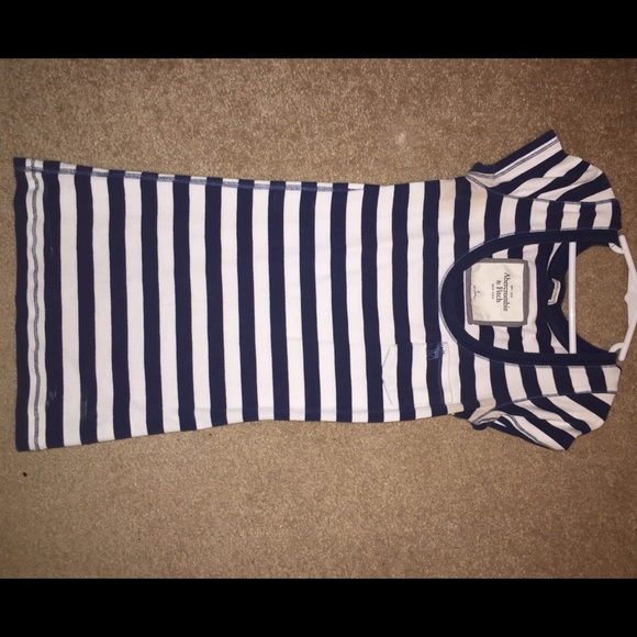 Fitted navy and white top.