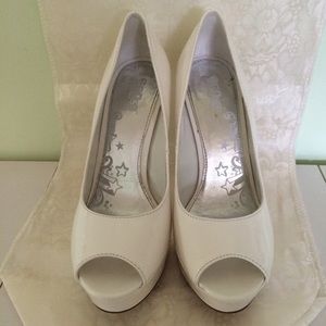 Brash white platform heels
