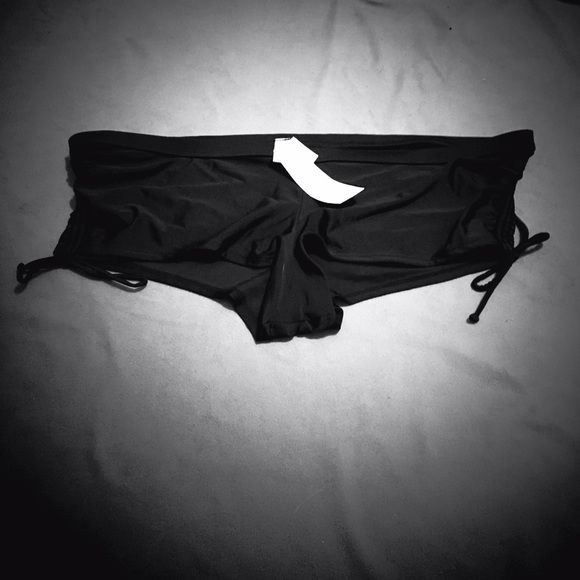 Black bikini bottoms with cinch ties on the sides