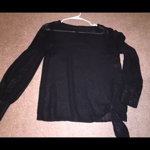 Long sleeve, sheer black top.