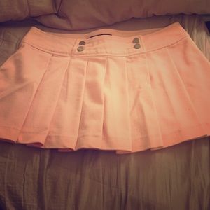 NWOT. Light pink mini skirt.