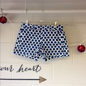 Blue and white polka dot shorts.