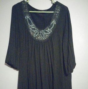 Beautiful black blouse with beaded detail.