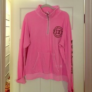 Pink half zip sweatshirt.