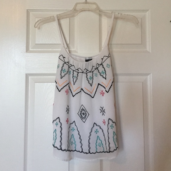 White tank top with multi color design.