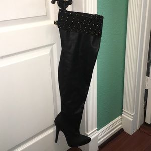Thigh high black boots with gold decor