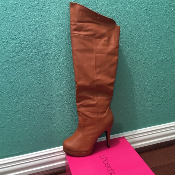 Over the knee cognac color boots.