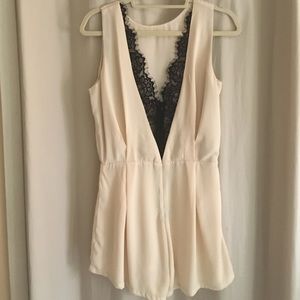 Cream jumpsuit with a black lace open back
