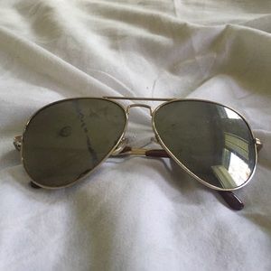 Ray Ban sunglasses. Has a streak mark on them.