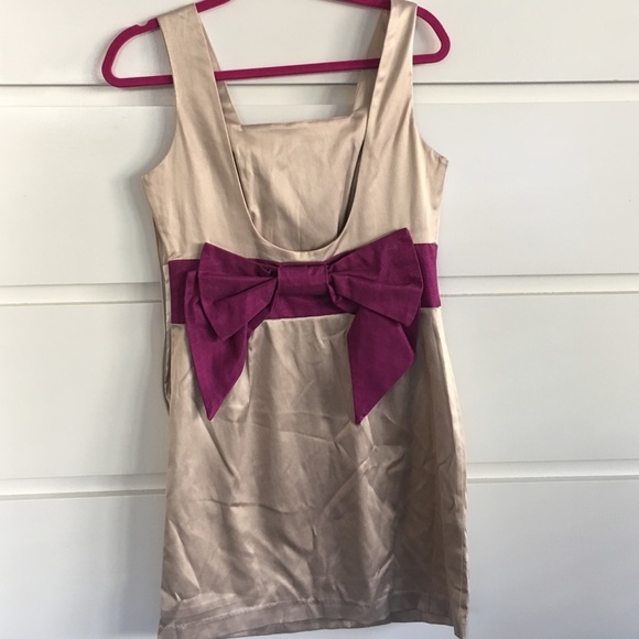 Tan satin dress with low back and now detail