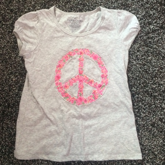 A gently used girls flowered peace sign shirt